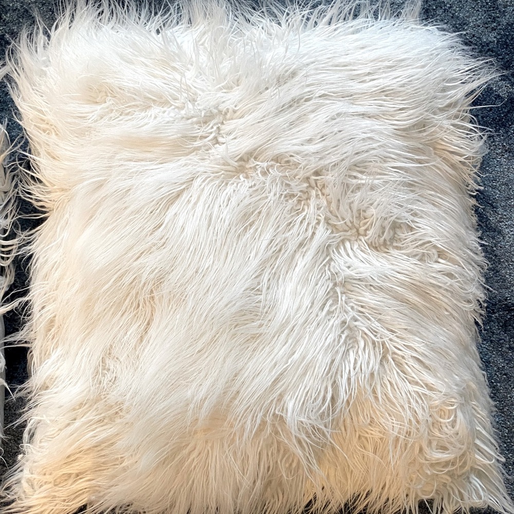 2 large matching faux-fur pillows